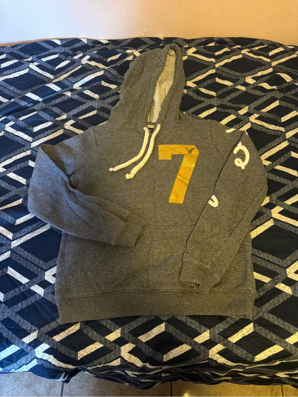 American Eagle Outfitters Gray Hoodie with Yellow '7' Graphic